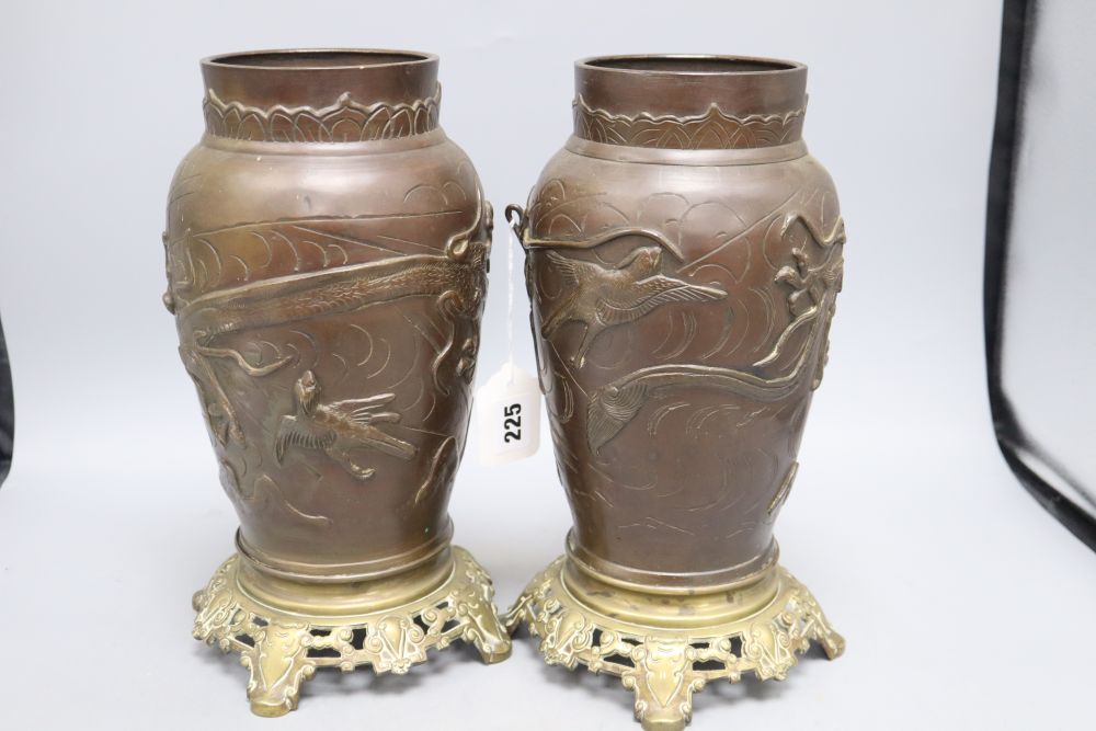 A pair of Japanese bronze vases with French bronze bases